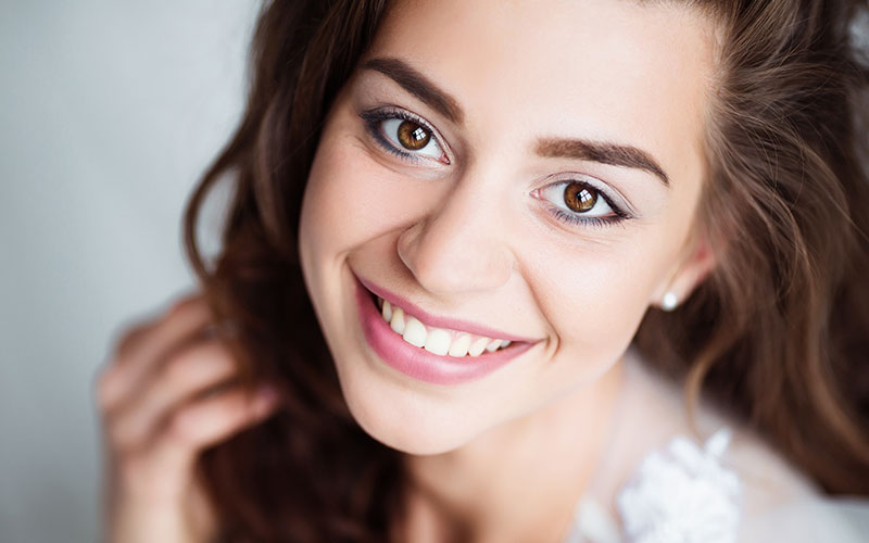 teen with straight teeth after Invisalign